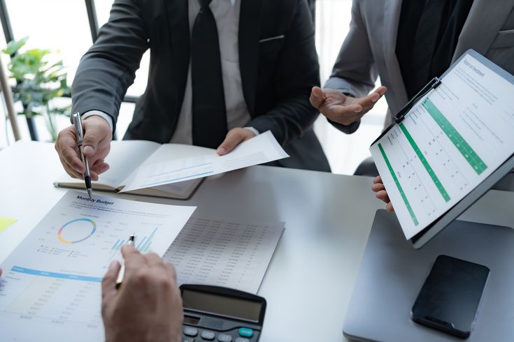 Business owner reading financial insights on a laptop