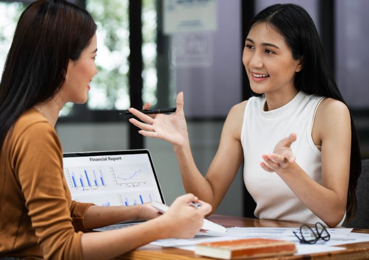 Team reviewing financial reports around a table